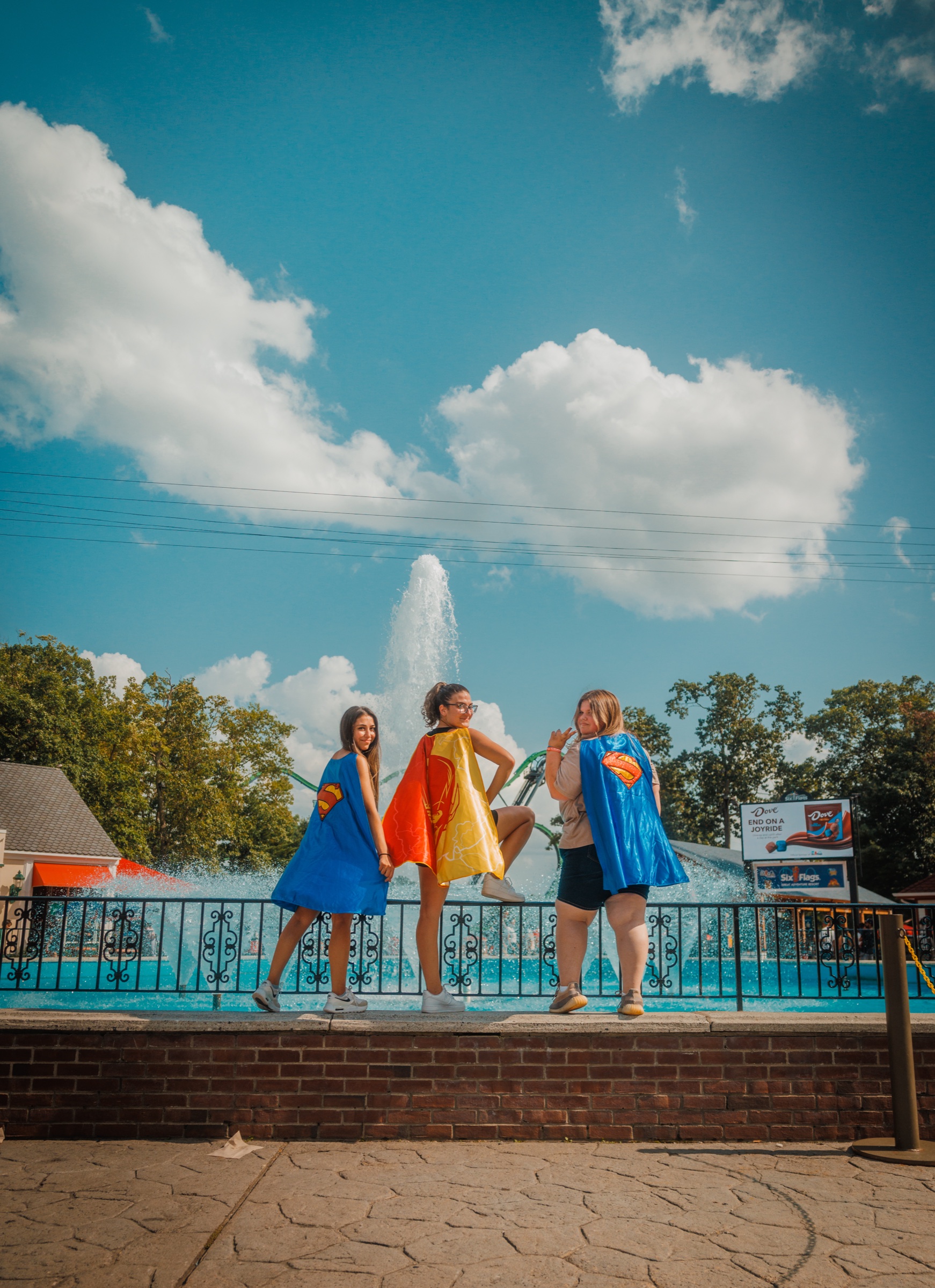 Friends wearing superhero capes during an EGYA summer outing