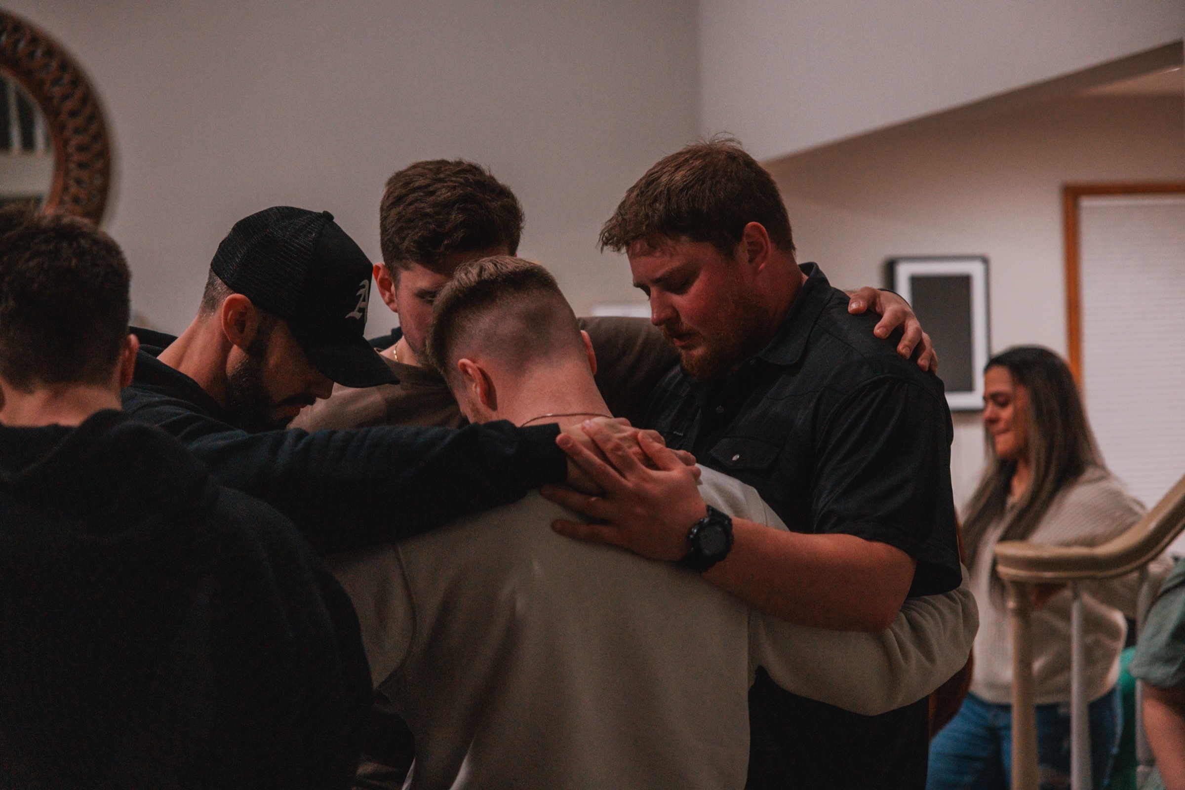 Friends praying together during an EGYA retreat