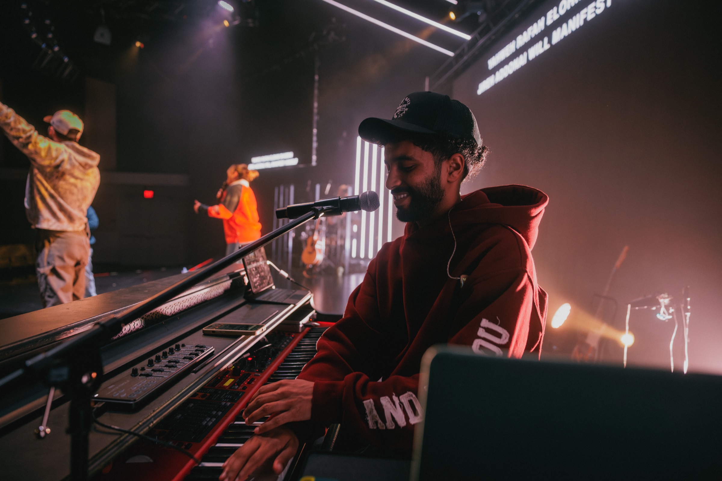 A keyboard player leading worship with the EGYA team